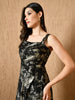 “Model wearing a black and gold metallic gown with front slit and sleeveless design – Kelin Fashion”

