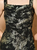 “Model wearing a black and gold metallic gown with front slit and sleeveless design – Kelin Fashion”

